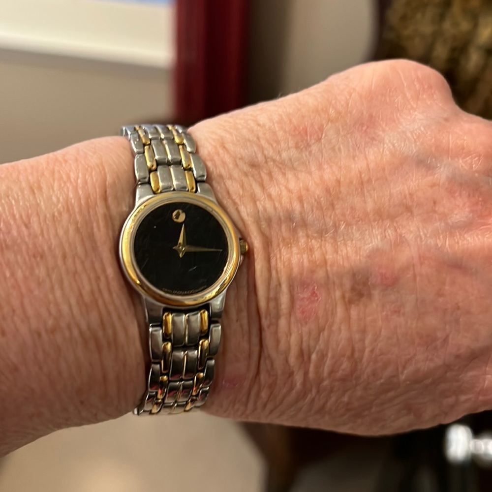 Movado silver/ gold small faced ladies watch. Works great! Brand new battery